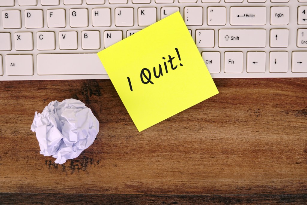 I Quit Text on Yellow Note -